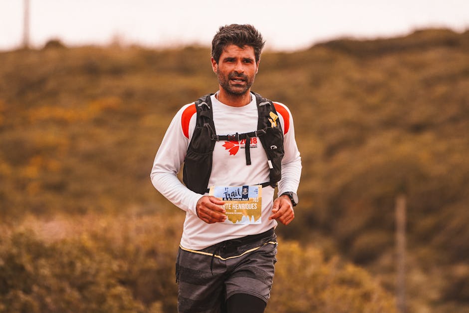 Anchorage Trail Race — July 24, 2026 — Trail runner with determination competing in an outdoor marathon event.