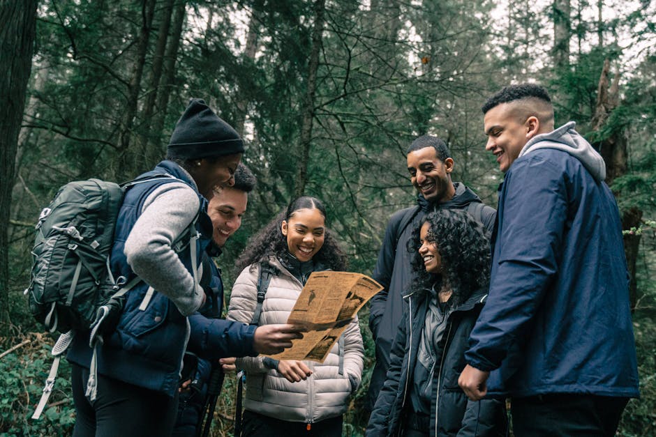 Denali Area Family Event — July 31, 2026 — Friends exploring a forest trail with a map, enjoying nature and adventure together.