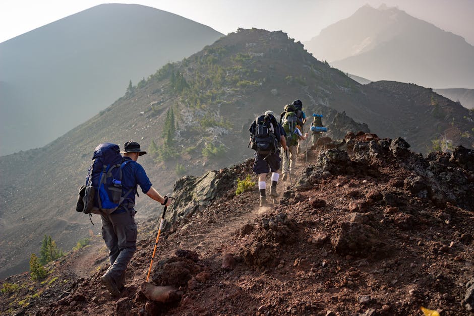 Denali Area Guided Hike — June 19, 2026 — Group of hikers trekking on a rugged mountain trail in Oregon's scenic outdoors.