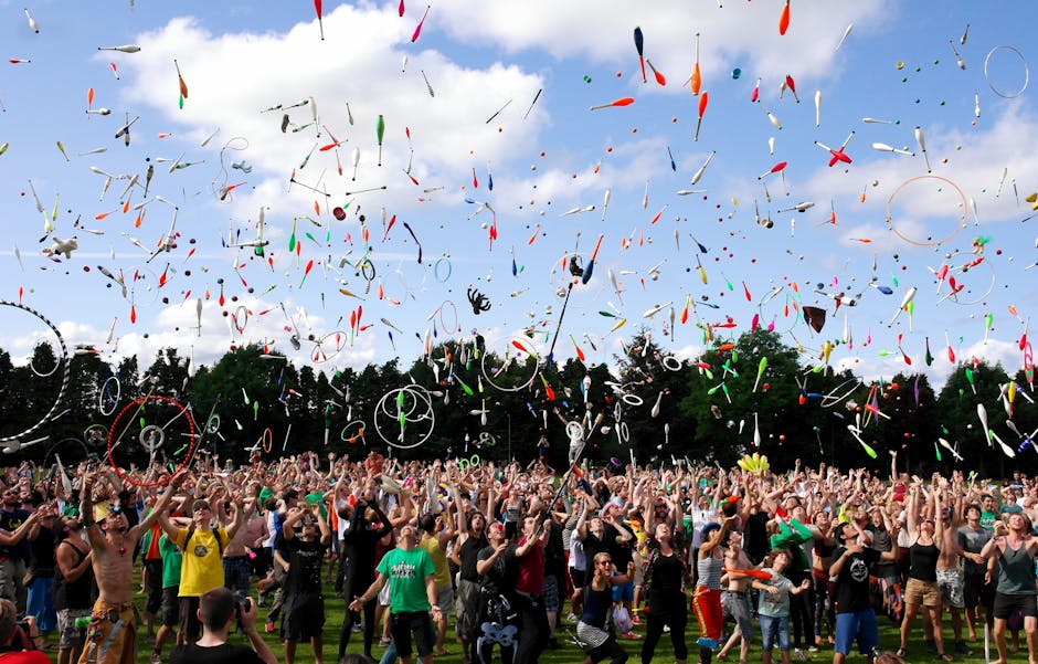 Fairbanks Summer Festival — July 17, 2026 — A lively crowd enjoying a colorful juggling event outdoors. Perfect for summer festival themes.