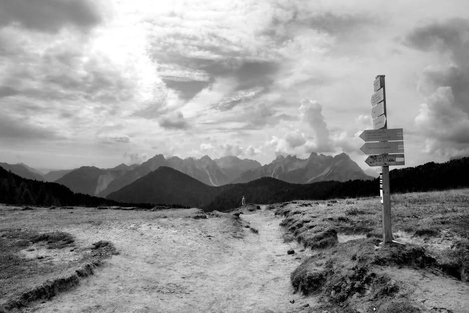 Flattop Mountain Guided Hike — April 18, 2026 — Explore a breathtaking black and white mountain landscape with hiking trails and distant peaks.